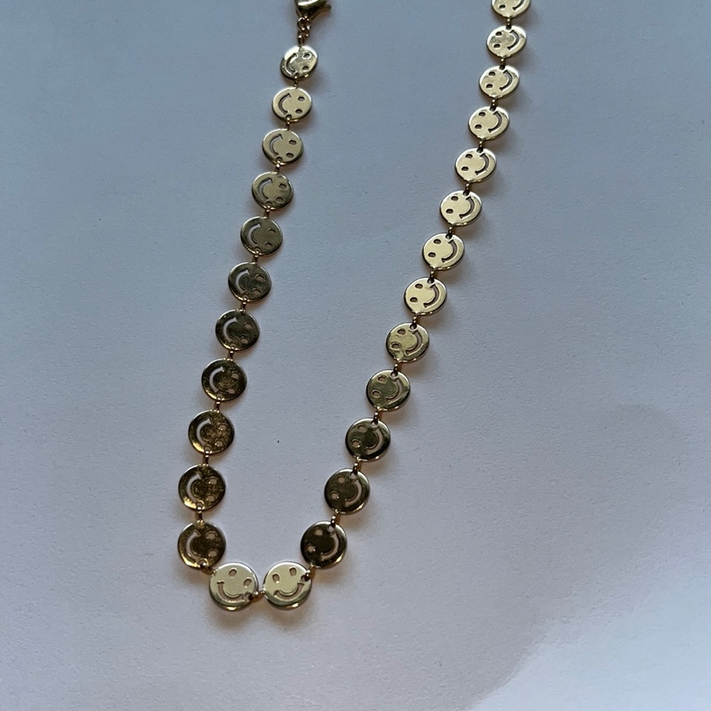 Gold smiling necklace